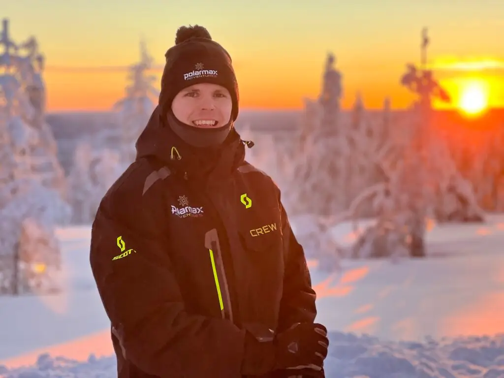 PolarMax guide on a fell top at sunset